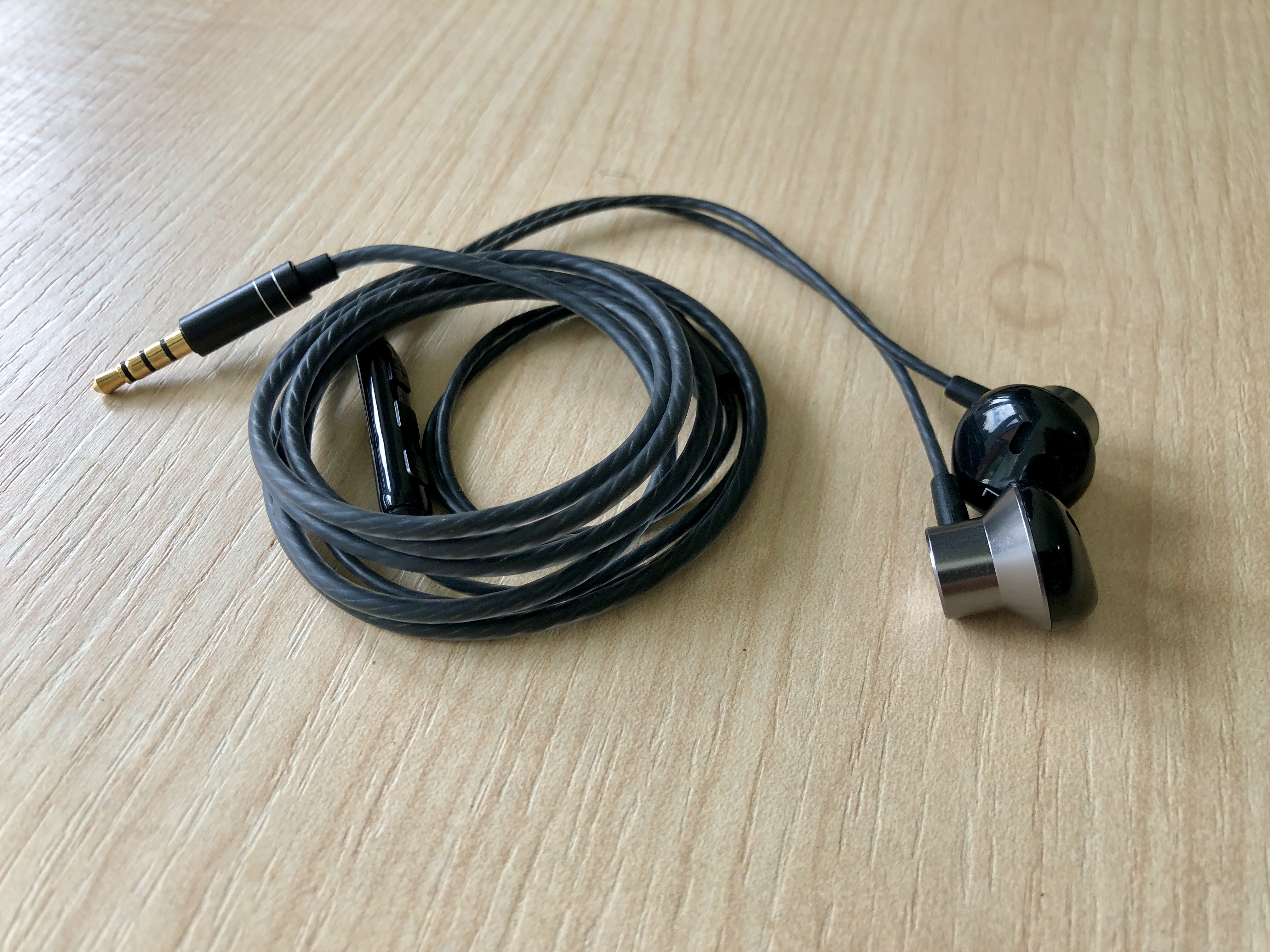 Photo of a pair of wired earbuds with a microphone
